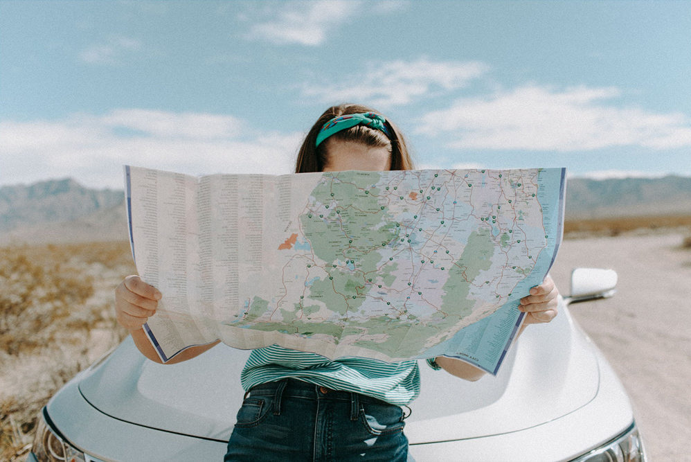 Reading a map on the side of the road